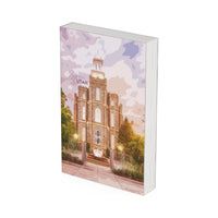 The front cover of the Logan Utah temple journal with the purple sky overhead.