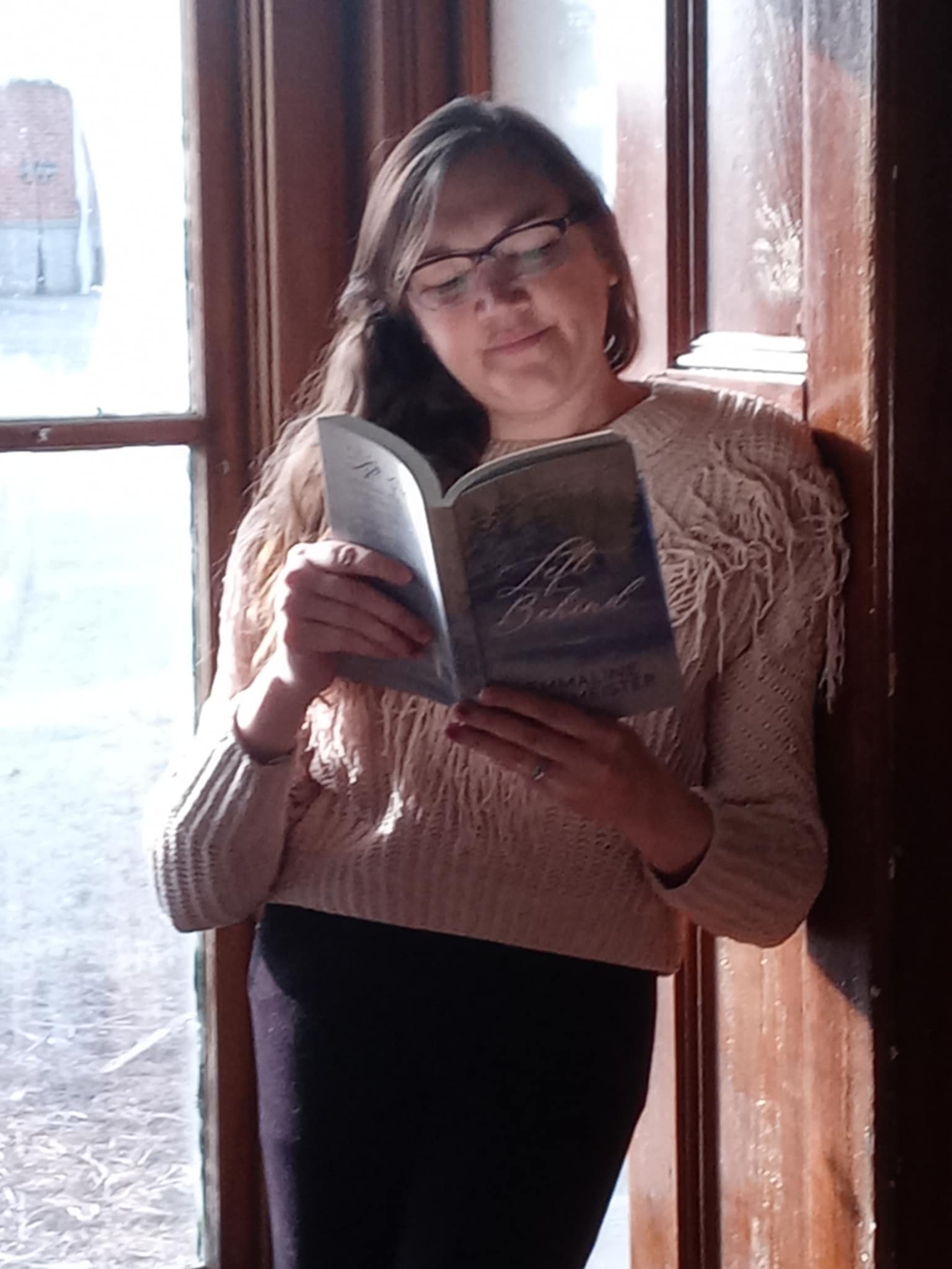 Reader Rachael Shelton Bohnhoff reading a copy of Left Behind; A Christian Novel