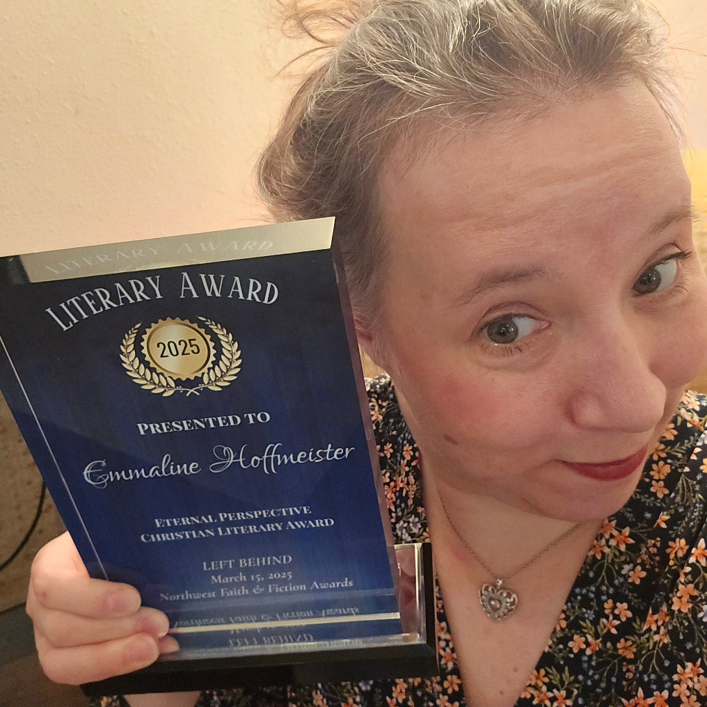 Author Emmaline Hoffmeister showing her eternal pespective christian literary award from the northwest faith & fiction awards.
