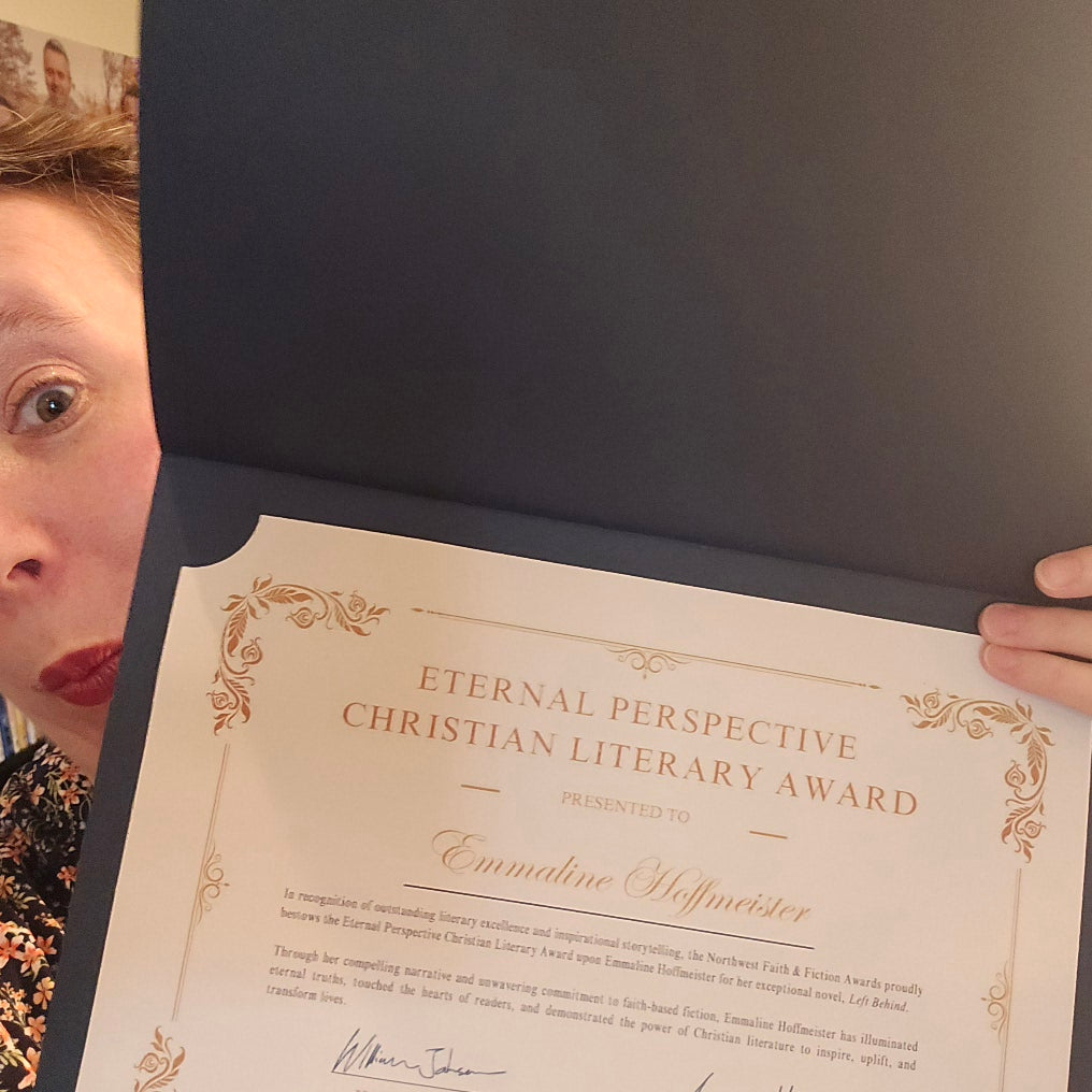 Author Emmaline Hoffmeister showing her eternal pespective christian literary award from the northwest faith & fiction awards.