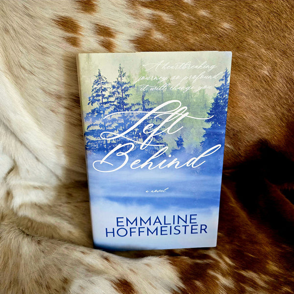 Book titled 'Left Behind' by Emmaline Hoffmeister on a fur surface