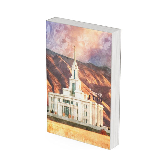 A watercolor paiting of the Payson Utah Temple on a journal. 